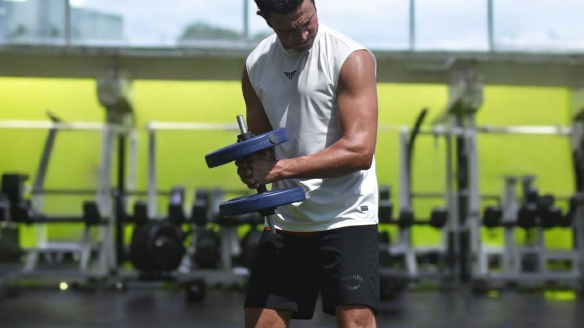 Man lifting weights in a gym